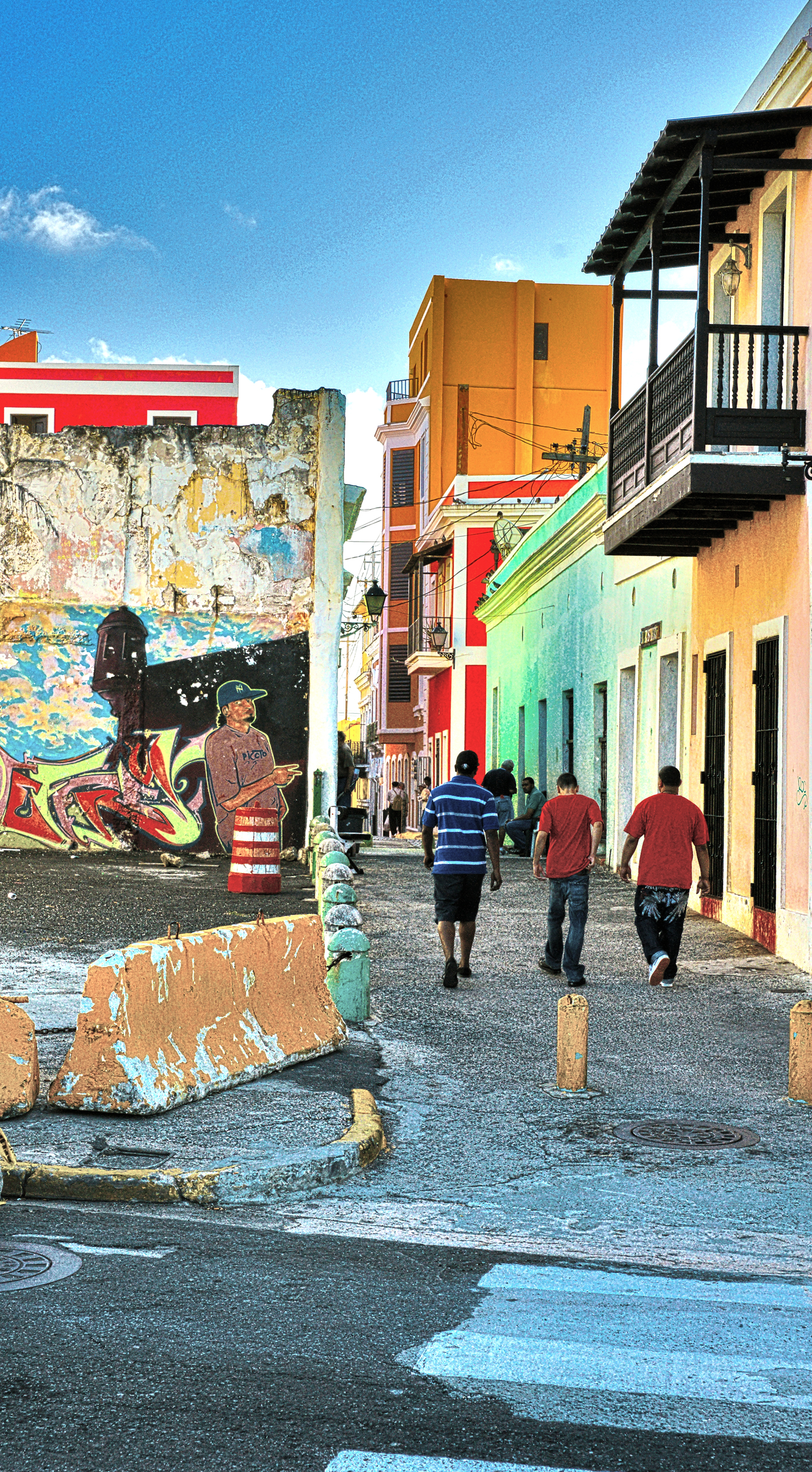 Three young men walking through Old San Juan.